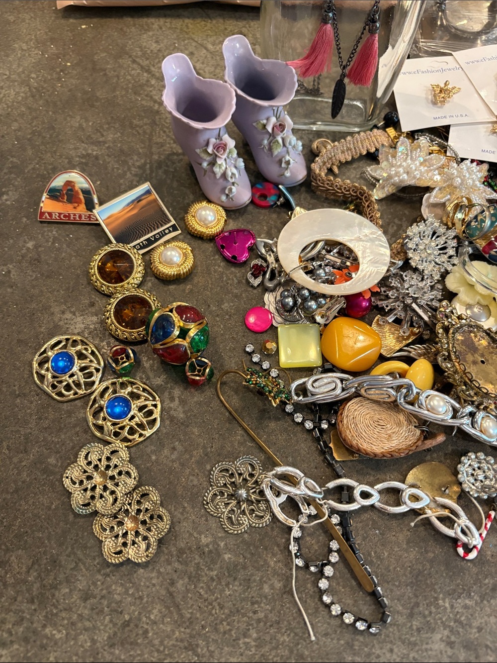 Lavender Ceramic Boot a cologne bottle and plenty of jewelry to work on